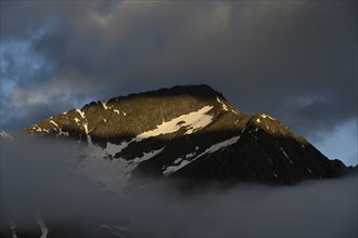 Rocky mountain peak Hochsteller in dramatic morning light, Berliner Höhenweg, Zillertal, Tyrol,