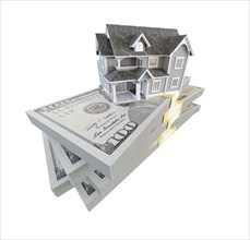 Miniature house resting on stack of thousands of dollars cash isolated on a white background