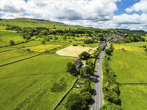 Farms and Fields over Bainbridge Village from a drone, Leyburn, North Yorkshire, England, United