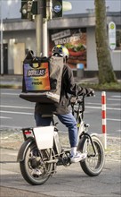 Bicycle courier from the fast delivery service Gorillas, delivers groceries, currently in over 20