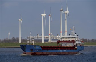 Cargo ship in the Ems estuary, wind turbines, Lower Saxony, Germany, Europe