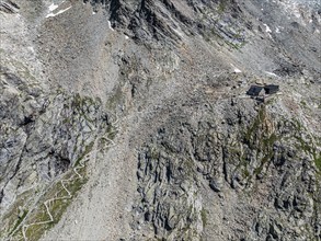 Mountain hut Cabane de Moiry, serpentines of hiking trail, aerial view, Valais, Switzerland, Europe