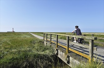 Cycling at the Westerheversand lighthouse, Schleswig-Holstein, Germany, Europe