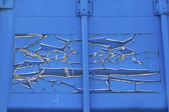 Close-up of cracked and peeling blue paint on metal shipping container, Quebec, Canada, North