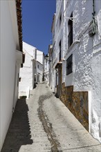 Typical white village Casares, houses, narrow alley on a hill, Route of the white villages, Malaga,