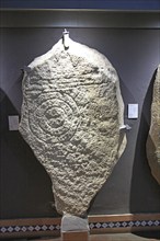 Bronze Age spiral patterns stone tablet in museum, Caceres, Extremadura, Spain, Europe