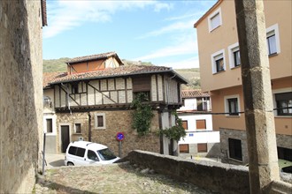 Traditional houses and modern homes architecture narrow street, Garganta la Olla, La Vera,