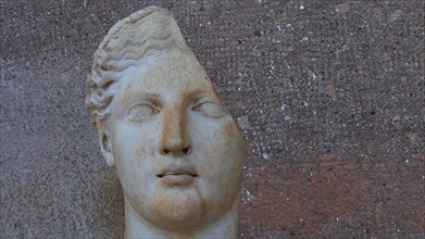 Preserved ancient bust with clear facial features, made of light-coloured stone, Archaeological