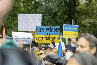 Sign Your peace is our death sentence at the counter-demonstration of some Ukrainians at the Die