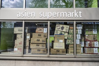 Shop window of an Asian supermarket, for food, full of packaging