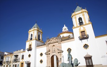 Church and sculpture of man with two lions, Plaza del Socorro, Ronda, Spain, Europe