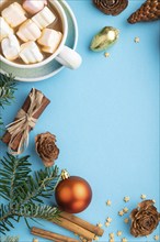 Christmas or New Year composition. Decorations, box, cinnamon, cones, fir and spruce branches, cup