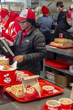 Sterling Heights, Michigan, Workers serve up Chickenjoy fried chicken at Jollibee, a Filipino fast