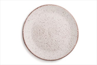 Empty pink dotted ceramic plate isolated on white background. Top view, close up