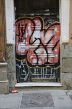 Graffiti spray painted on door, Malasana barrio, Madrid city centre, Spain, Europe