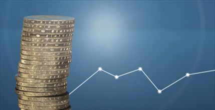 Stacked euro coins against a blue background