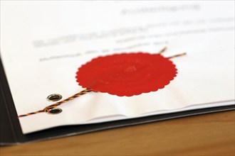 Notarised contract with red official seal