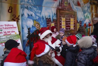 Europe, Germany, Bremen, Christmas market, St Nicholas reading to children, Hamburg, Hamburg,