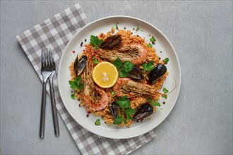 Seafood paella, shrimp and mussels risotto, rice, homemade, top view, no people