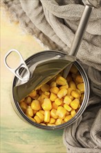 Open tin can, with corn, top view, selective focus, no people, close-up