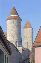 Round jug defence tower with historic town wall and square Hertelsturm, town fortification,