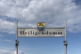 Welcome sign Heiligendamm with coat of arms of Bad Doberan and Heiligendamm at the pier,