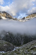 Cloudy mountain landscape with summit Hochsteller and Griesferner with snow and glacier, Berliner