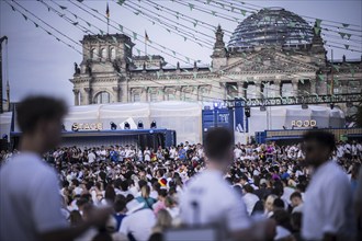 Scenes in the fan zone on Platz der Republik in front of the Reichstag building taken in Berlin, 29