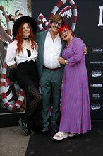 Cinzia-Paulina Dräger, Jörg Dräger and his woman Petra Dräger at the opening of the Tim Burton