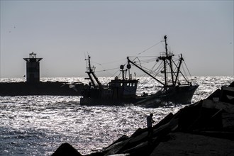 Fishing vessel TH10 DIRKJE, off the coast of Scheveningen, The Hague, with spread nets, beacon of