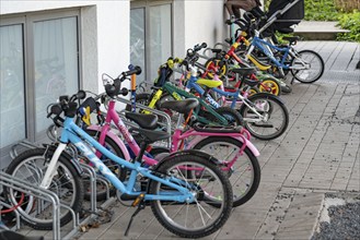 Children's bicycles in front of a day care centre