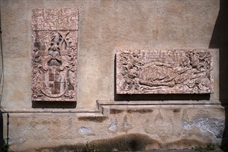 Historic gravestones on the outer wall of the parish church, parish church of St Nicholas, Merano,