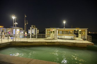 Vaporetto landing stage at night, Venice, Metropolitan City of Venice, Italy, Europe