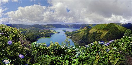 Picturesque panoramic view of the crater lakes Lagoa Verde and Lagoa Azul surrounded by green