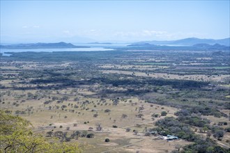 View over dry plain to the sea, Mirador Nacaome, Barra Honda National Park, Costa Rica, Central