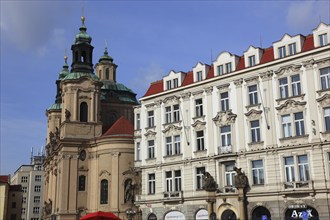 Historic houses and the baroque St Nicholas Church on the Old Town Square, Prague, Czech Republic,