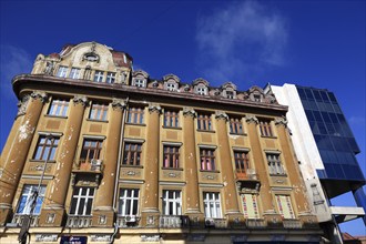 Houses, old building and modern building with glass facade, Romania, Banat, Timisoara, Timisoara,