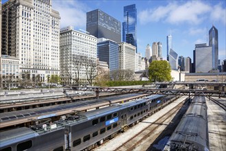 Skyline with METRA commuter train railway at Van Buren Street station in Chicago, USA, North