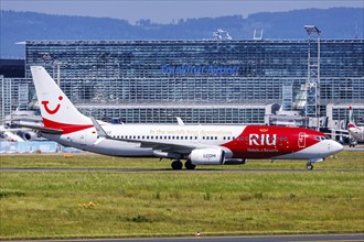 A Boeing 737-800 aircraft of TUI with the registration D-ATUZ and the RIU Hotels & Resorts special