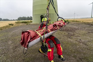 Height rescuers from the Oberhausen professional fire brigade practise abseiling from a wind