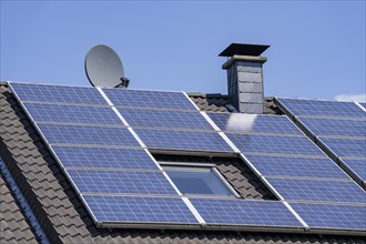 Solar system on the pitched roof of a residential building, photovoltaics for power generation, for