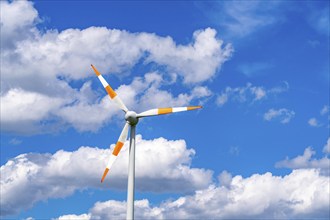 Wind turbine, wind energy plant from the manufacturer Enercon, blue sky with many white clouds,