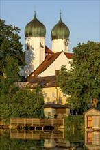 Romanesque Benedictine Abbey Seeon Monastery, monastery church St. Lambert with reflection in the