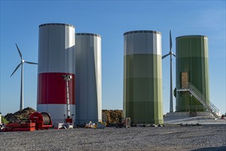 Construction site of a new wind turbine, modules of the tower, wind turbine from the manufacturer