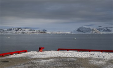 Red bollard and harbour boundary, harbour area, Ny-Ålesund, Kongsfjord, Spitsbergen Island,