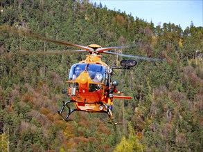 On-board mechanic of the rescue helicopter Christoph 14 winching with the cable winch, Bad