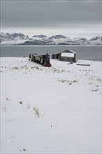 Historic mine railway in winter landscape, Kongsfjord, Ny-Ålesund, Spitsbergen Island, Svalbard and