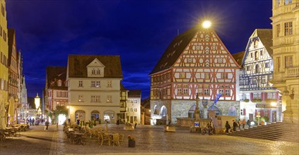 The market square in the old town centre of Rothenburg ob der Tauber, illuminated at night.