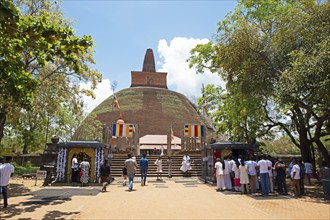 Sri Lankan pilgrims at the Abhayagiri Stupa in the holy city of Anuradhapura, North Central