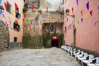 Decorated alley and colourful houses, feast of the Madonna of Regnos Altos, Bosa, district of